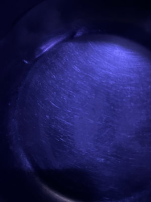 Close-up of skin under blue light.