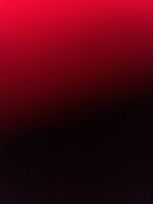 Solid red to black gradient background, no person or object visible.