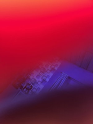 Empty room with red lighting and wall decor.