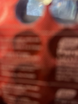 Blurry red package with circular holes.