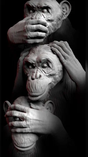 Three monkey sculptures stacked vertically, hands covering mouth, ears, and eyes, in dark studio
