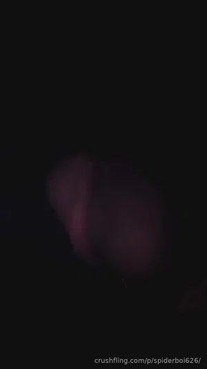 Blurry dark image with indistinct shape, no clear person or setting visible.