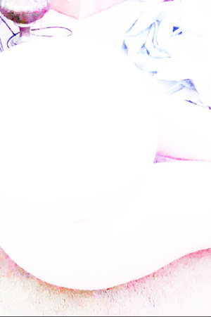 Overexposed image with faint outlines of a glass and fabric, mostly white.
