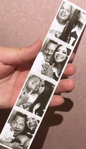 Black man and woman in casual shirts posing in photo booth strip.