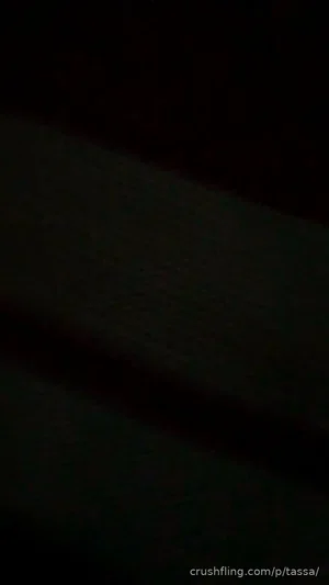 Dark, indistinct image with no clear person or object visible.