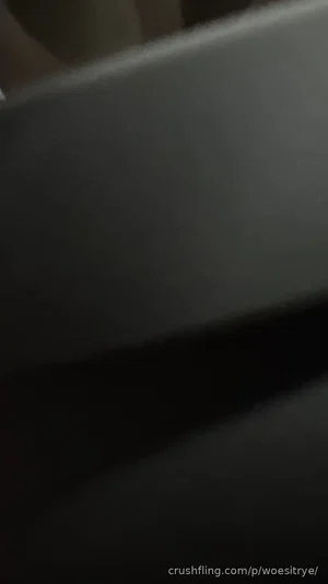 Blurry dark image, unclear subject or setting.